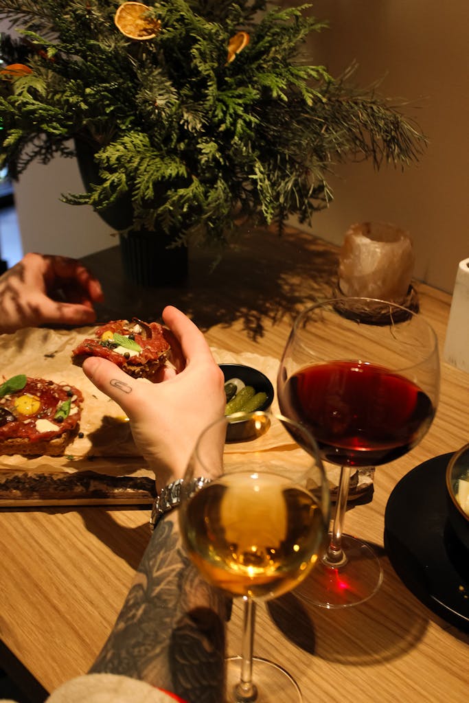 An intimate dining scene with wine and appetizers in Wrocław, Poland.